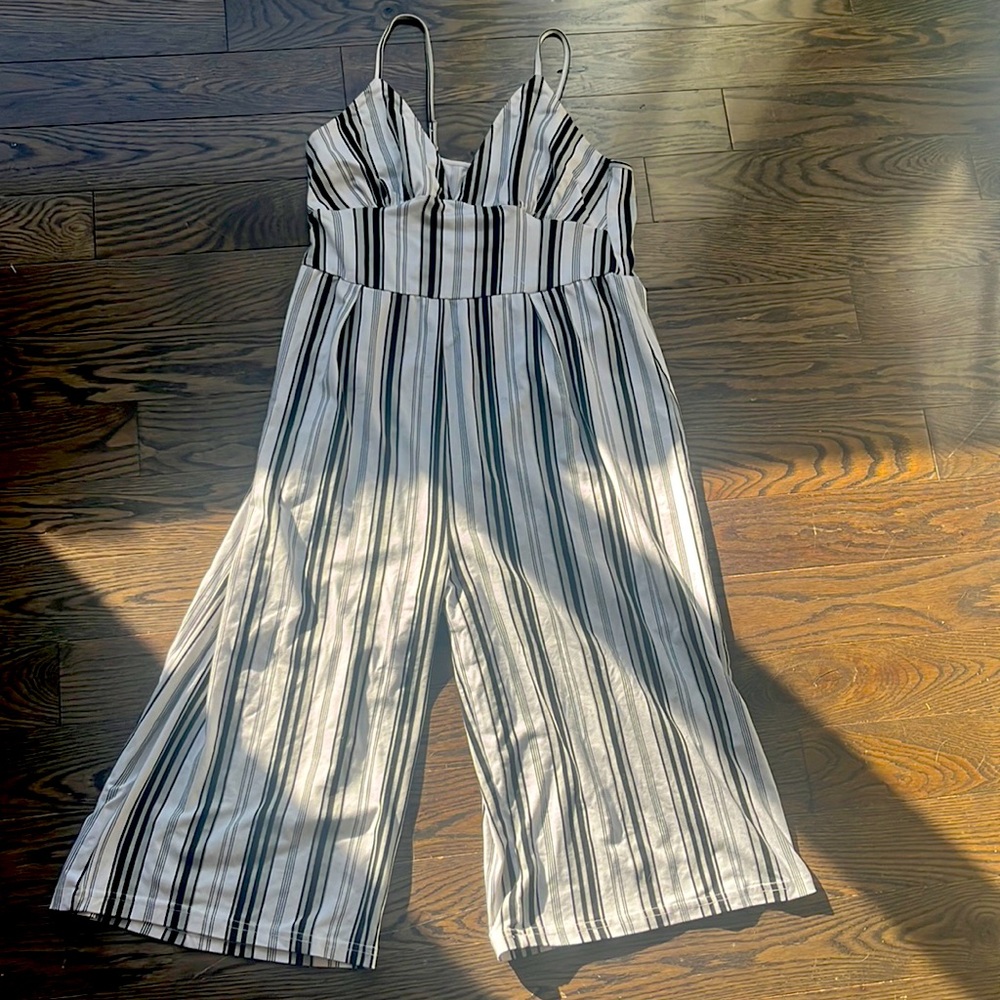 Black and white medium striped jumpsuit, brand is Kendall and Kylie